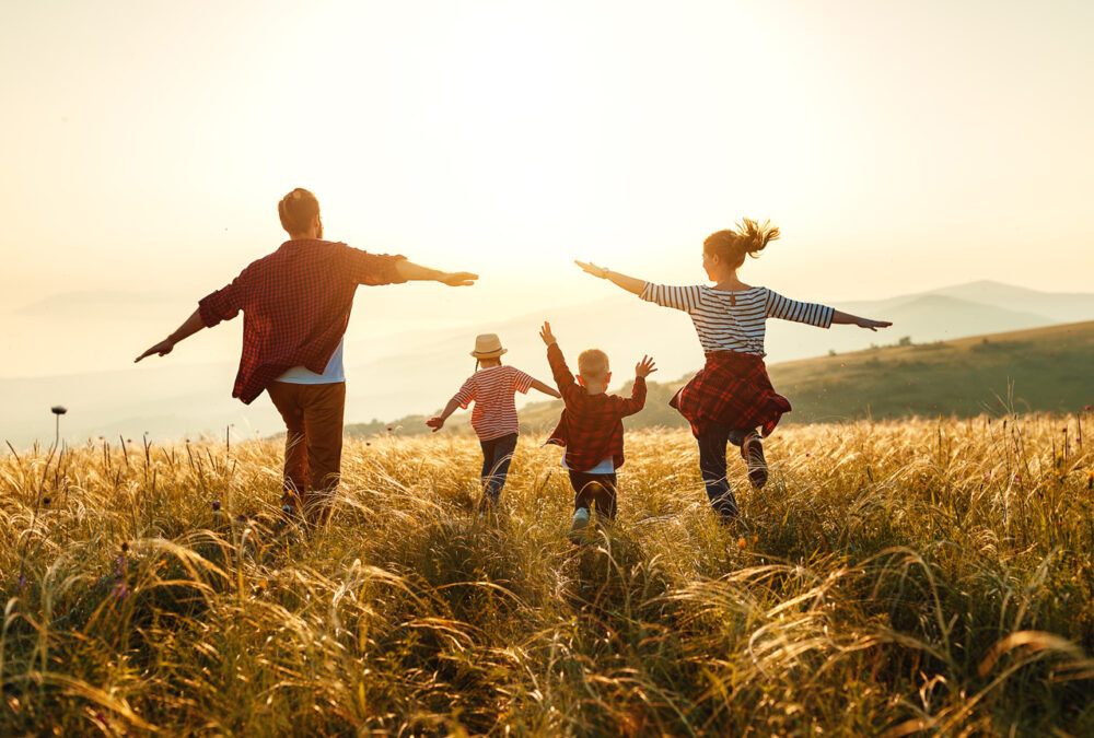 Family running in a field
