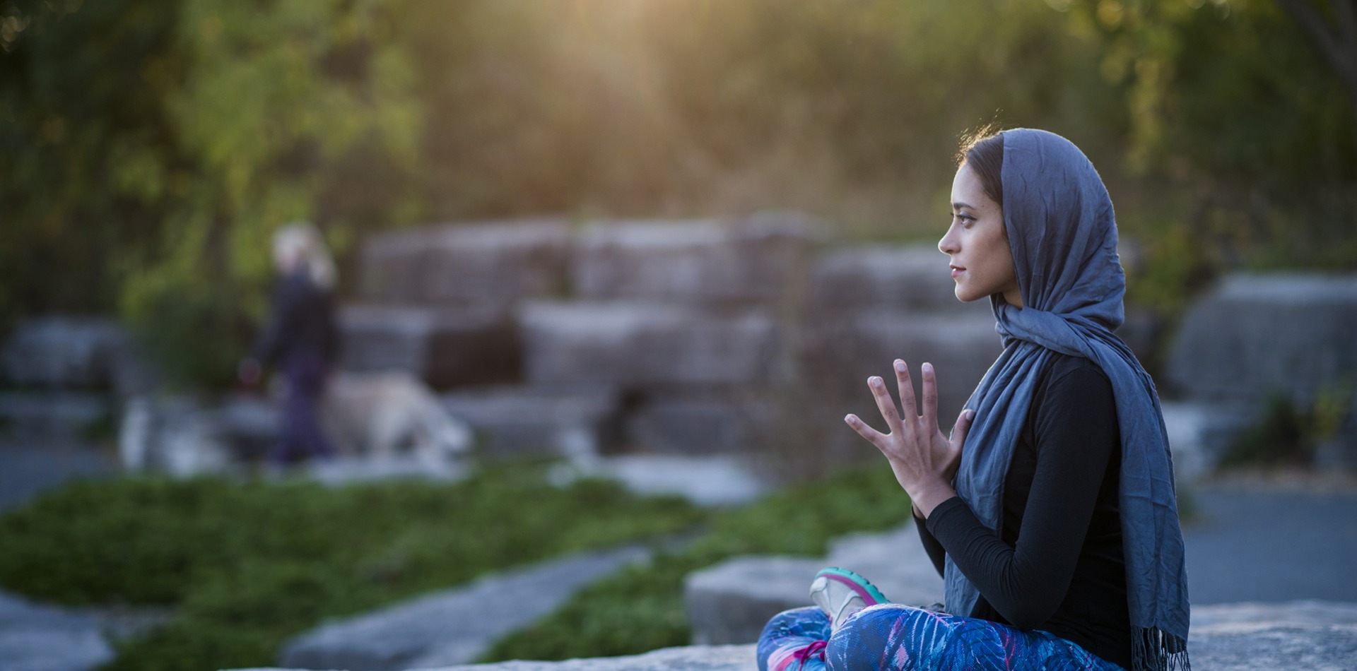 Muslim woman enjoying quiet meditation in park